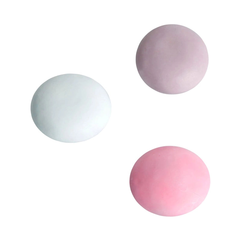 Small round pink, white and purple drops covered in a crunchy sugar shell.