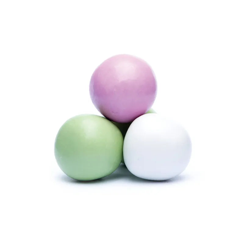 Small pastel-colored candy balls with hard and smooth sugar coating.