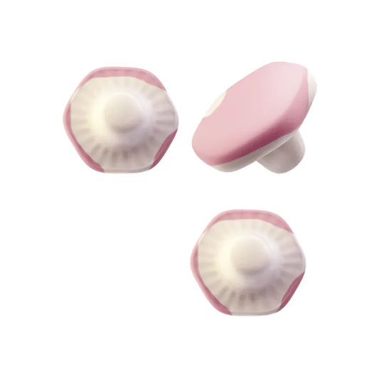 Pink and white mushroom-shaped foam candy.