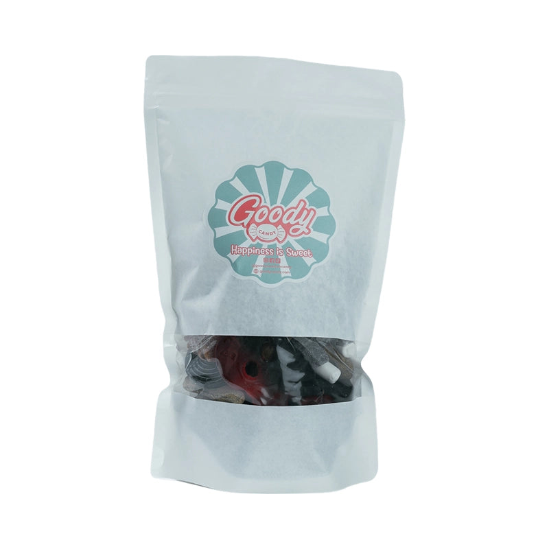 White bag with assorted licorice candies in various shapes and colors.