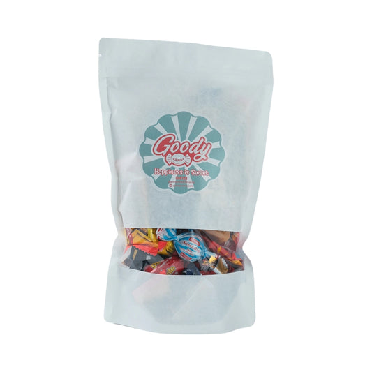 White bag with assorted wrapped candy and chocolate.