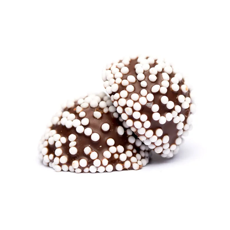 Small chocolate-covered balls decorated with white sugar pearls.