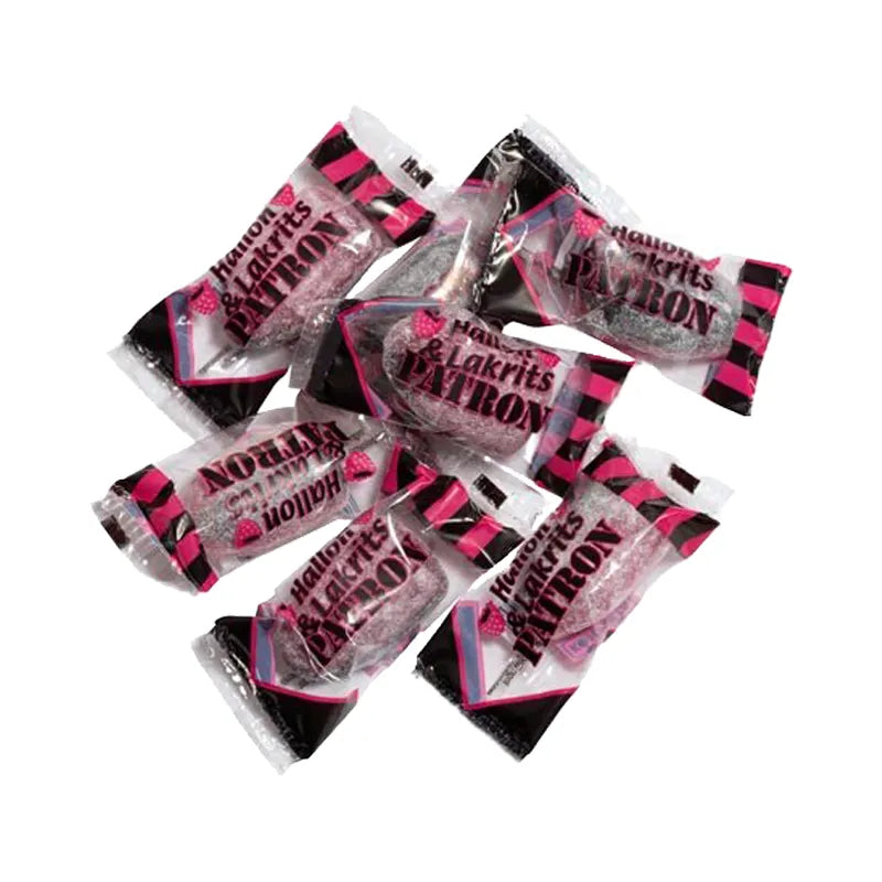 Black and pink bullet-shaped hard caramels in transparent wrapping.