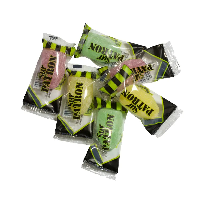 Colorful bullet-shaped hard caramels in transparent wrapping.