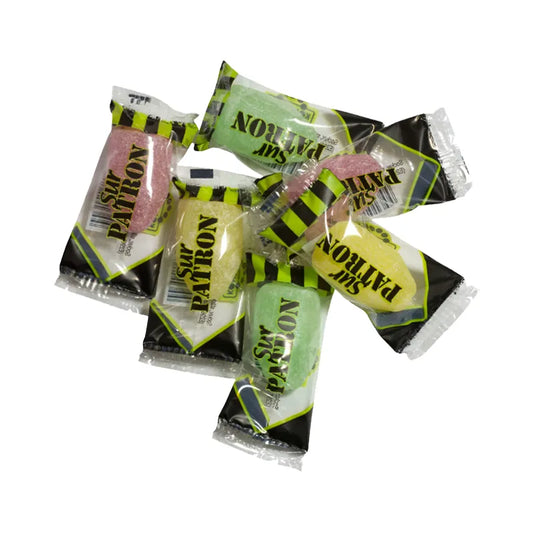 Colorful bullet-shaped hard caramels in transparent wrapping.