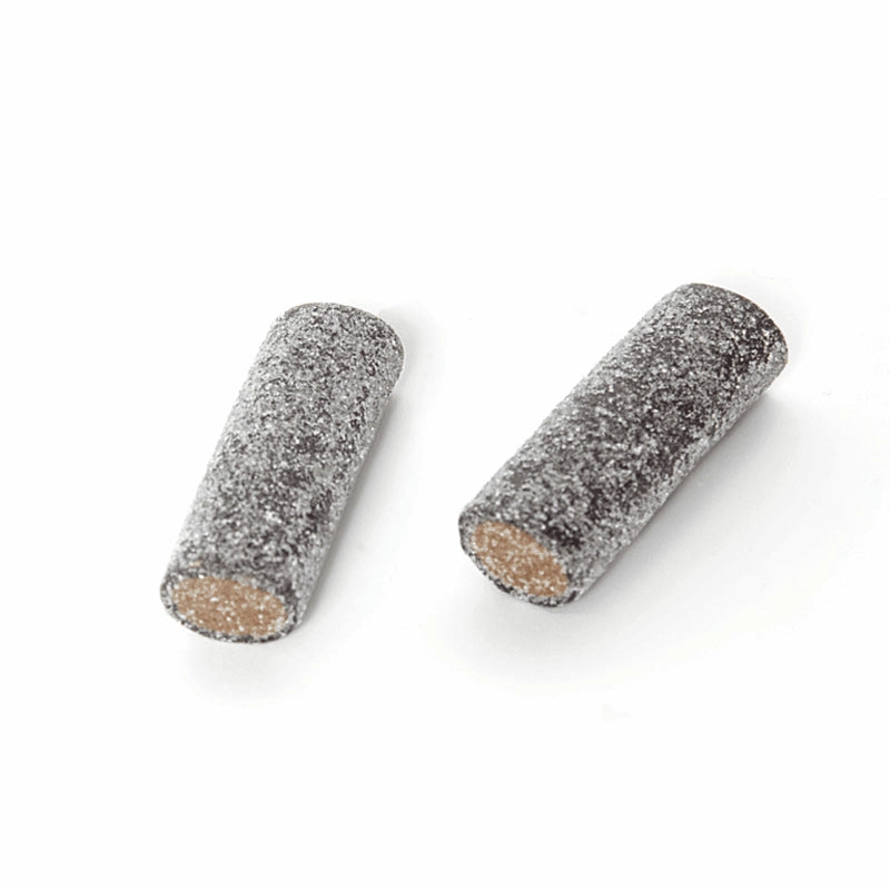 Black and brown salt-coated tube-shaped chewy candy by Toms.